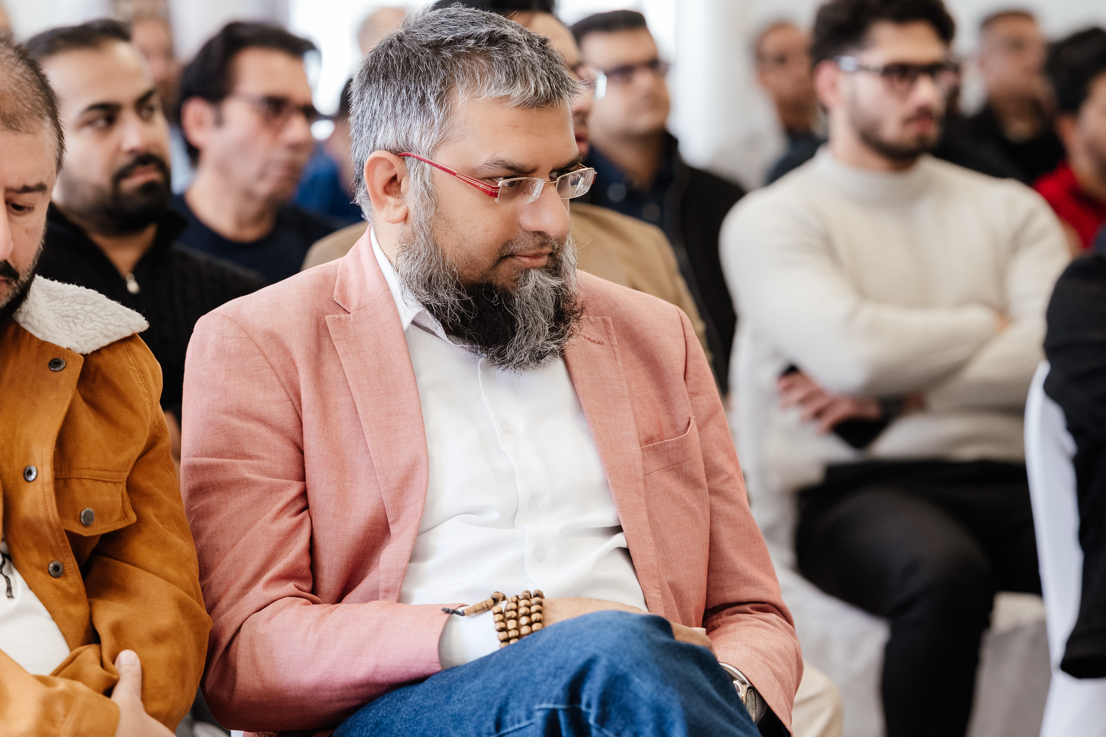 Zeeshan Usmani reflecting during a professional session, illustrating the journey from research insight to real-world execution and impact